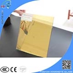 Gold colored reflective laminated glass